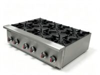 Side angle of Infernus 6 burner commercial gas hob showing stainless steel construction and sturdy pan supports